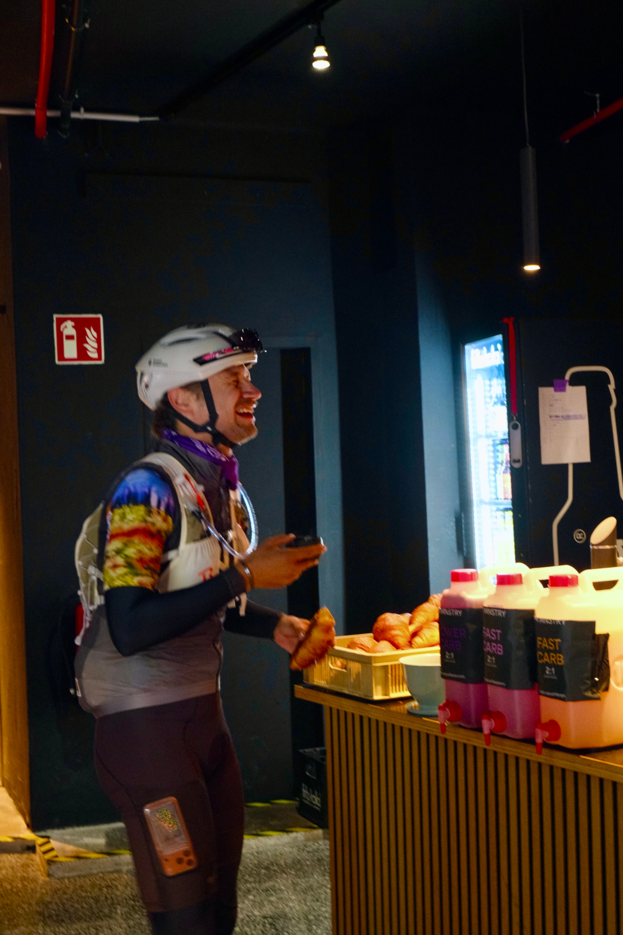 A smiling rider sharing a café moment at Drop The Alps